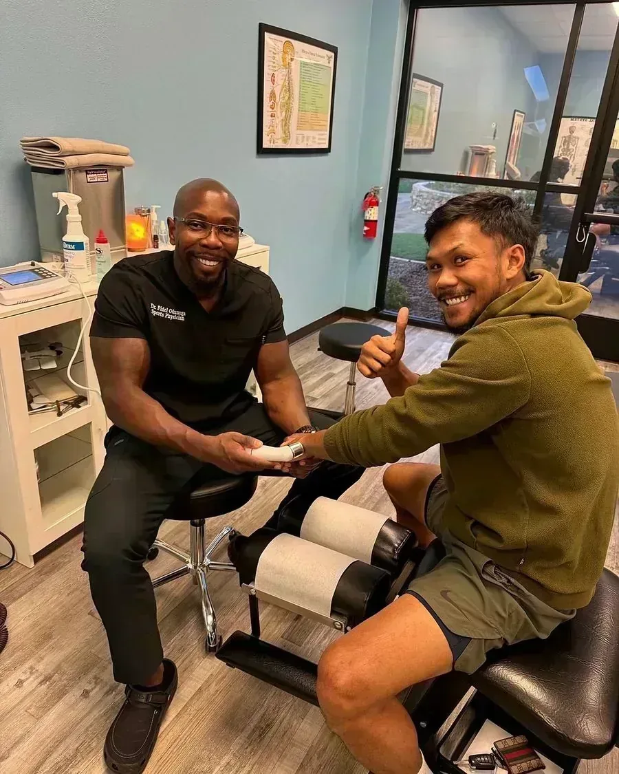 Dr. Odunuga with a patient in a HALO treatment room