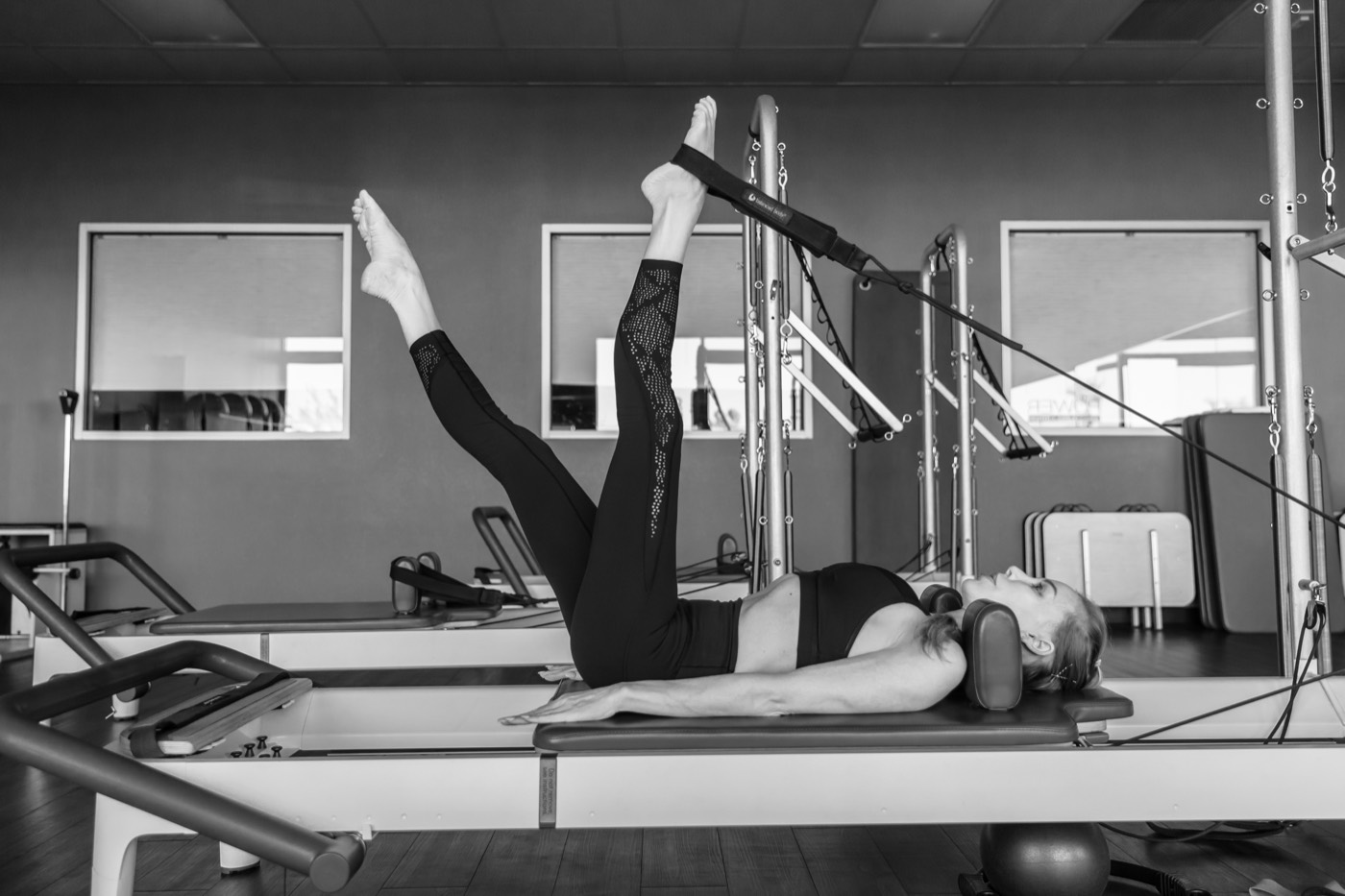 Precise leg work in straps on the reformer