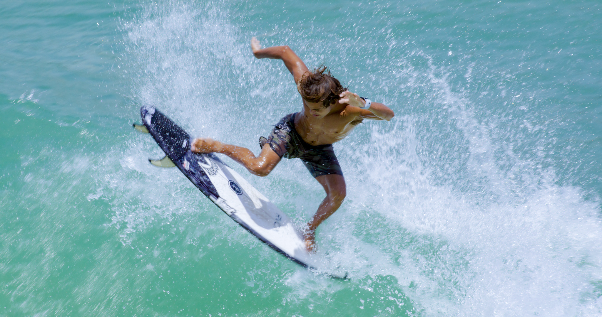 Surfer boosting off the lip at Trestles level